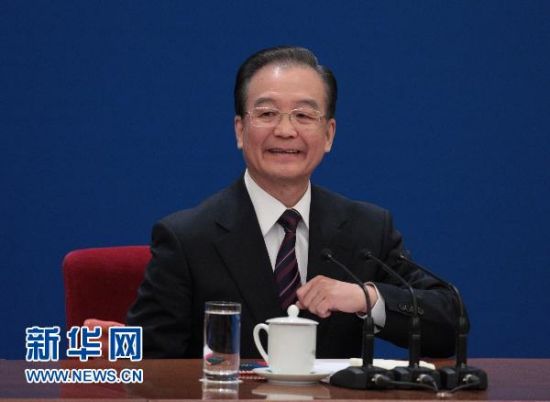 3月14日，国务院总理温家宝在北京人民大会堂与中外记者见面，并回答记者提问。 新华社记者 邢广利摄